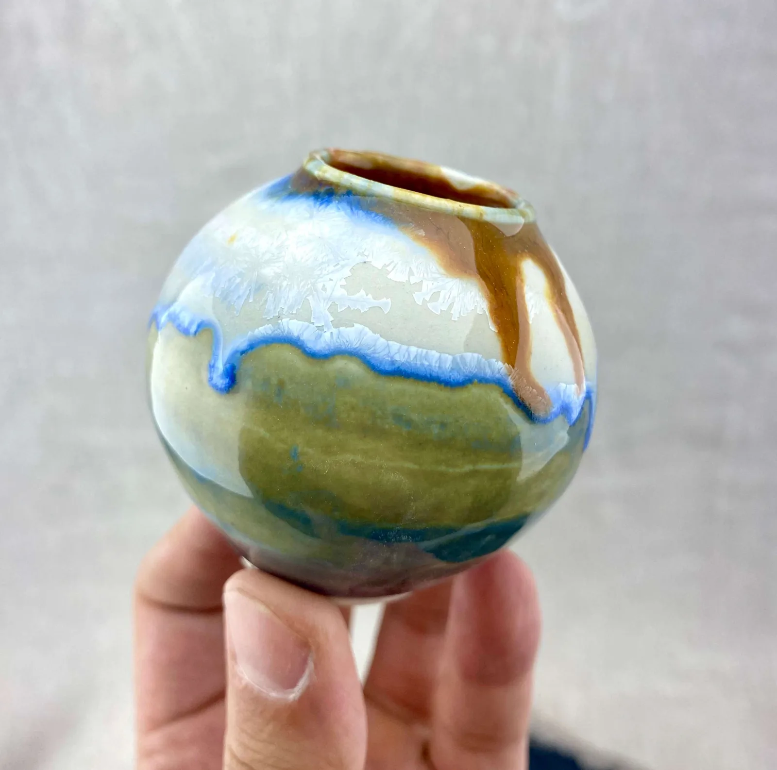 Contemplative pottery piece with crystalline glaze