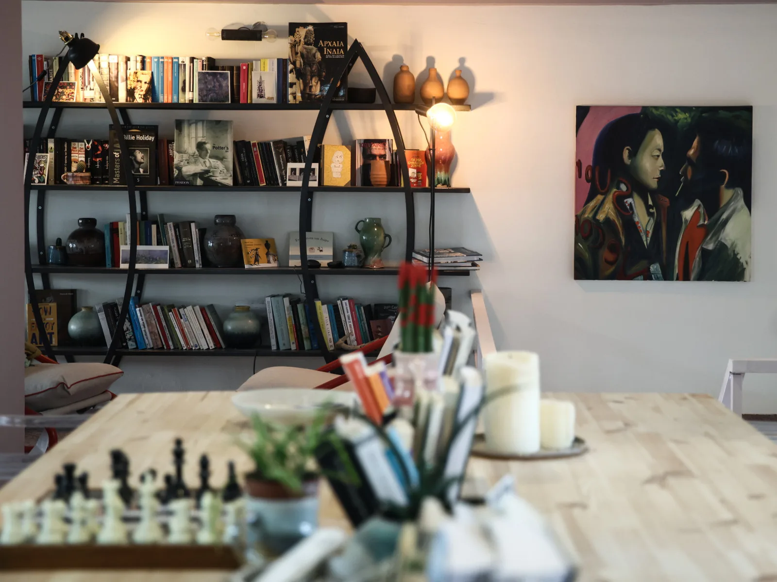 Pottery studio workspace with shelves and finished pieces